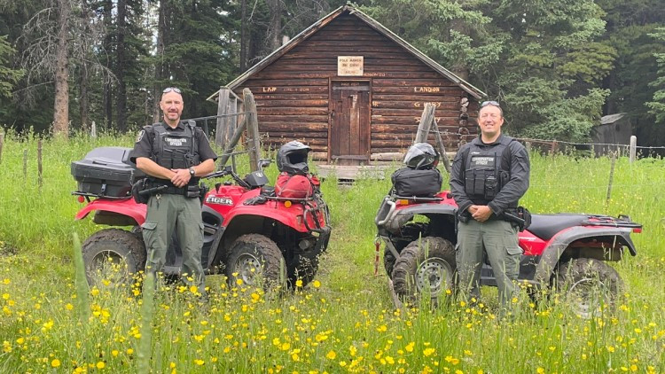 Conservation officers in Alberta with quads
