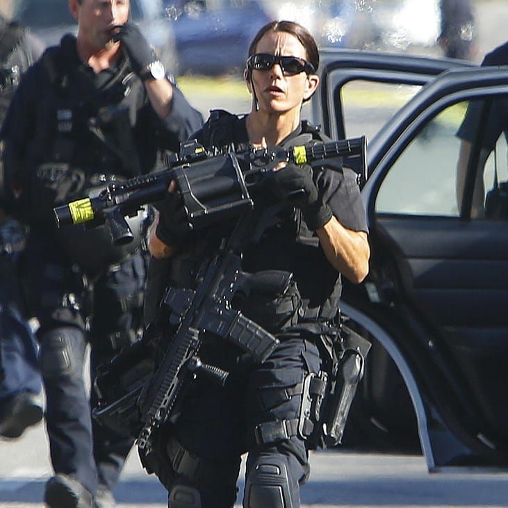 Female SWAT officer in full tactical gear