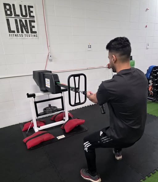 Practicing on the Push/Pull machine at Blue Line Fitness Testing in Edmonton, Alberta